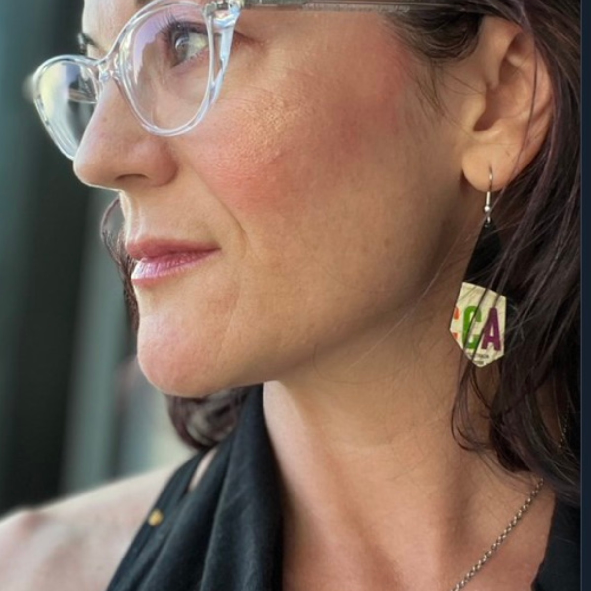 reVinyled collector wearing her earrings