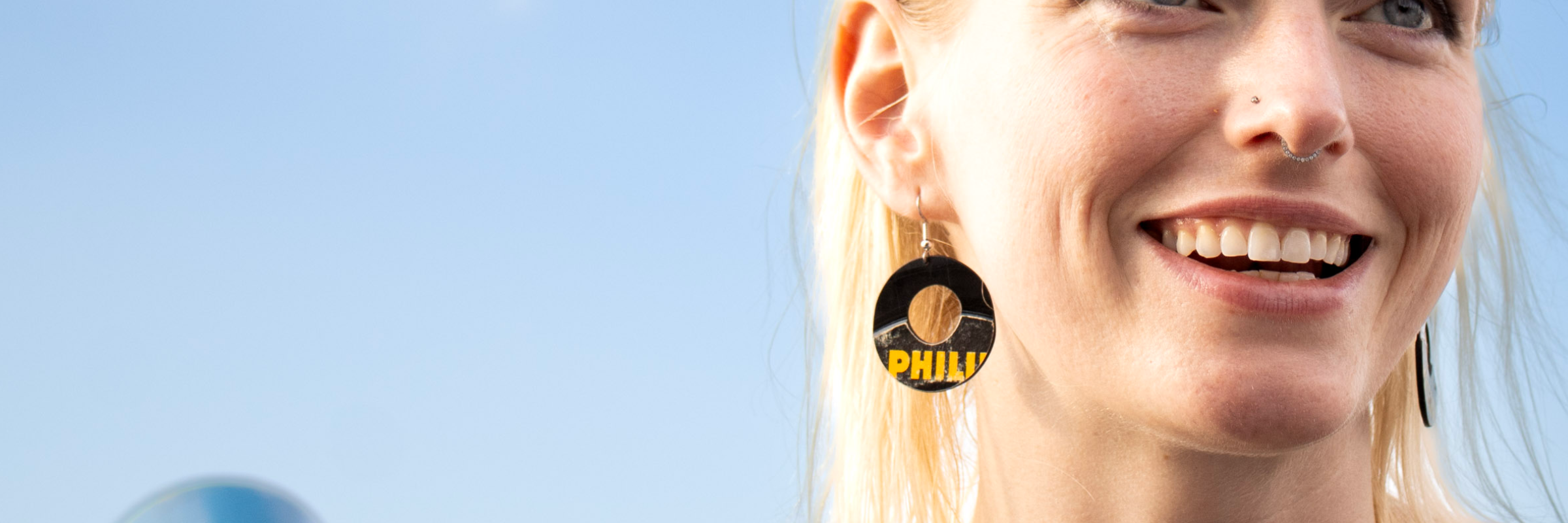 Model wearing reVinyled center-hole earrings