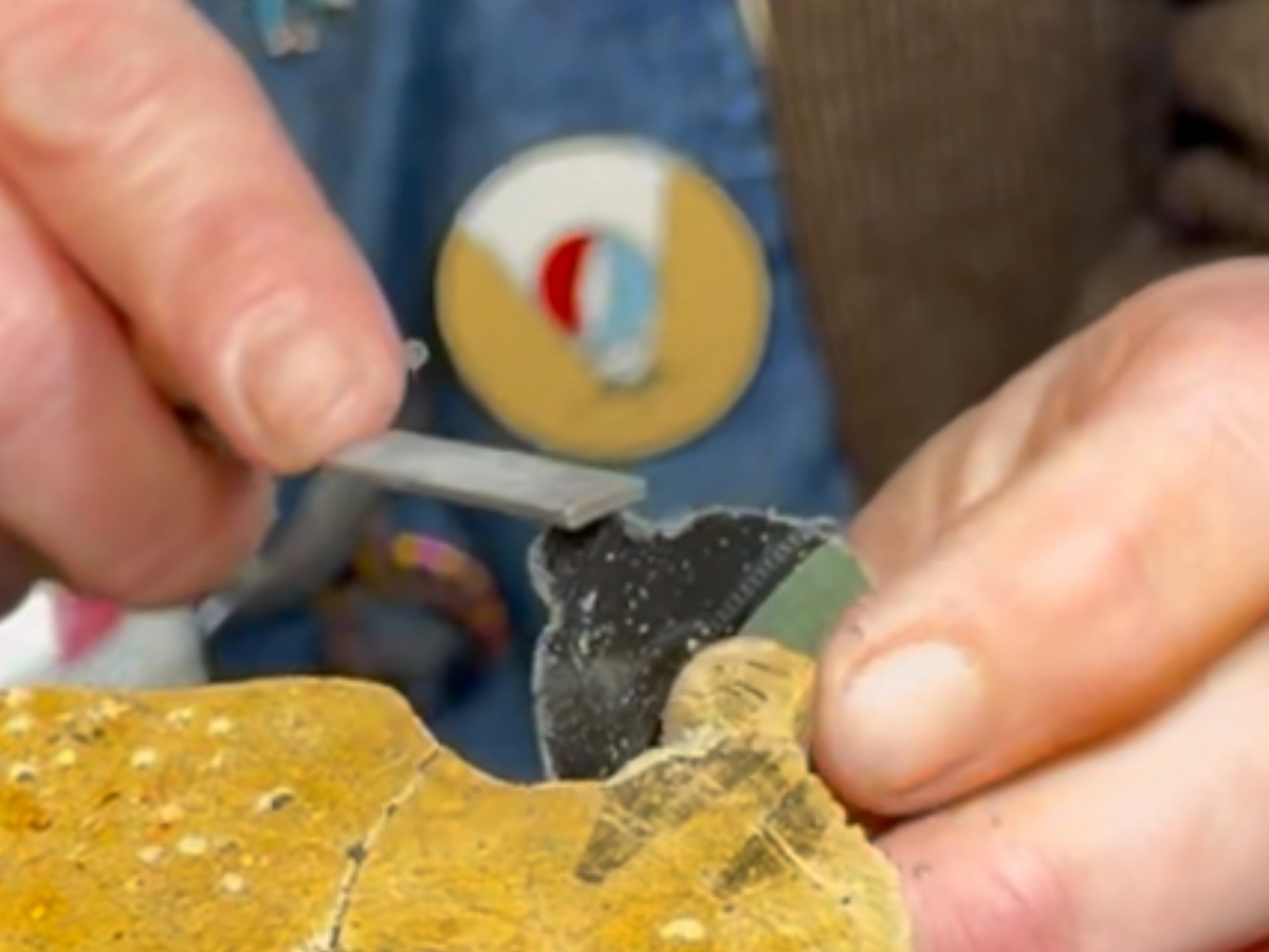 Hand filing a reVinyled earring