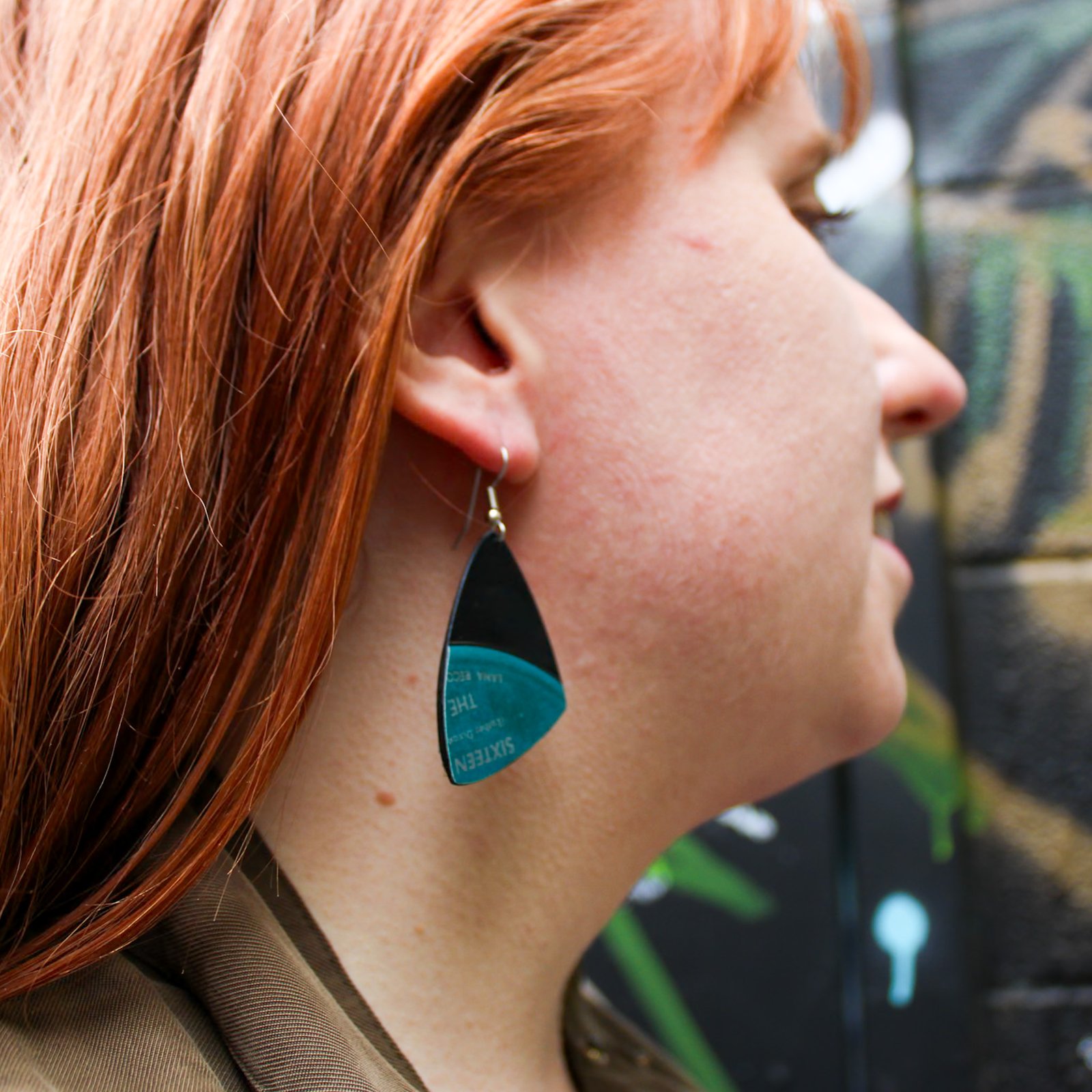 Home Process Blue Earring Model wearing blue earrings made from a vinyl record